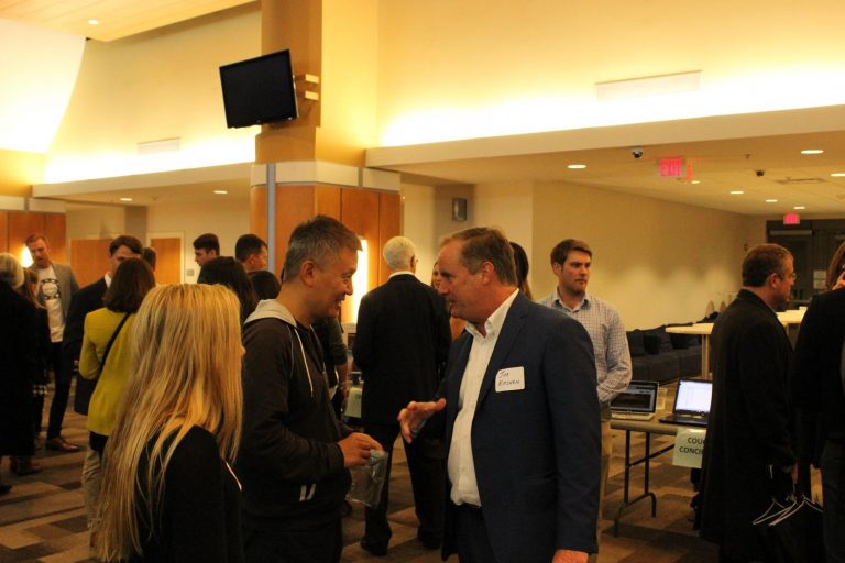 UNC entrepreneur-in-residence Jim Kitchen networks with pitch party attendees.
