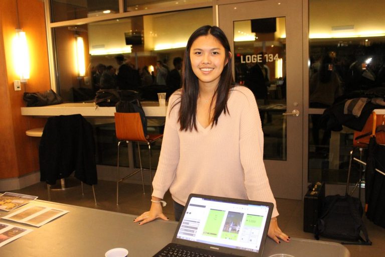 A student entrepreneur demos the technology behind her venture SlideThatMoney, which allows users to earn money by interacting with mobile ads.