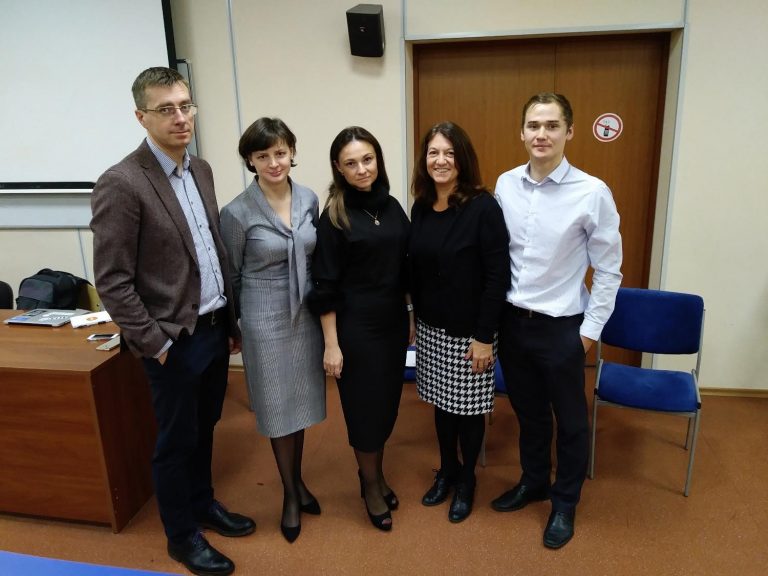 Dina Rousset (second from right) with the dean of the business school (far left) at Synergy University.