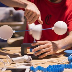 Students create prototypes to pitch during the Makeathon